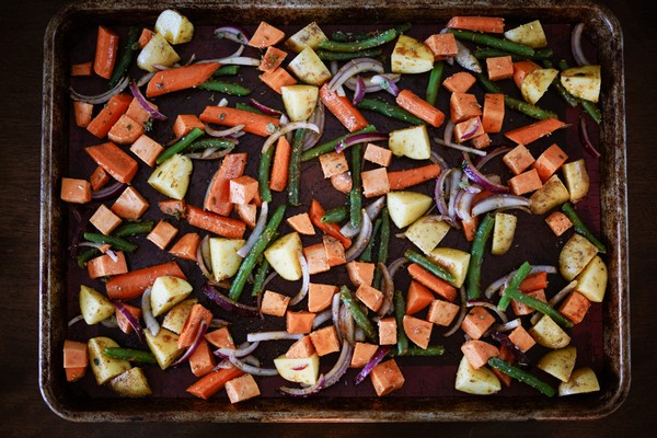A pan of diced root vegetables before going into the oven.